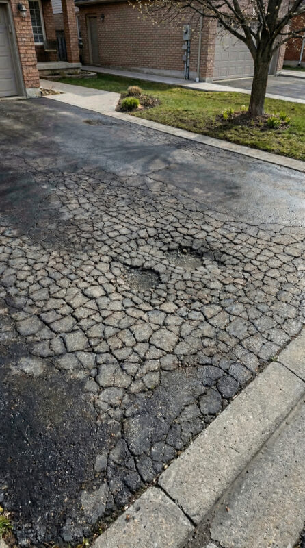 What causes cracks and potholes in asphalt driveways? - Affordable Interlock Construction, Interlock Sealing, Garage Ramp Installation, Driveway Extension, Crack Filling, Driveway Painting and Asphalt Maintenance in Vaughan, Richmond Hill, Maple, Markham, Woodbridge, Aurora, Newmarket and beyond.